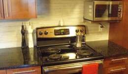 A Kenmore (Electrolux) electric stove in a condo kitchen